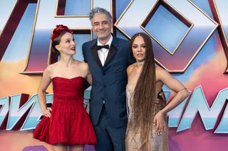 Director Taika Waititi posing with actors Natalie Portman and Tessa Thompson at the Thor: Love and Thunder premiere