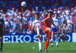 Enzo Scifo of Belgium and Michel Platini of France battle for the ball at Euro 1984