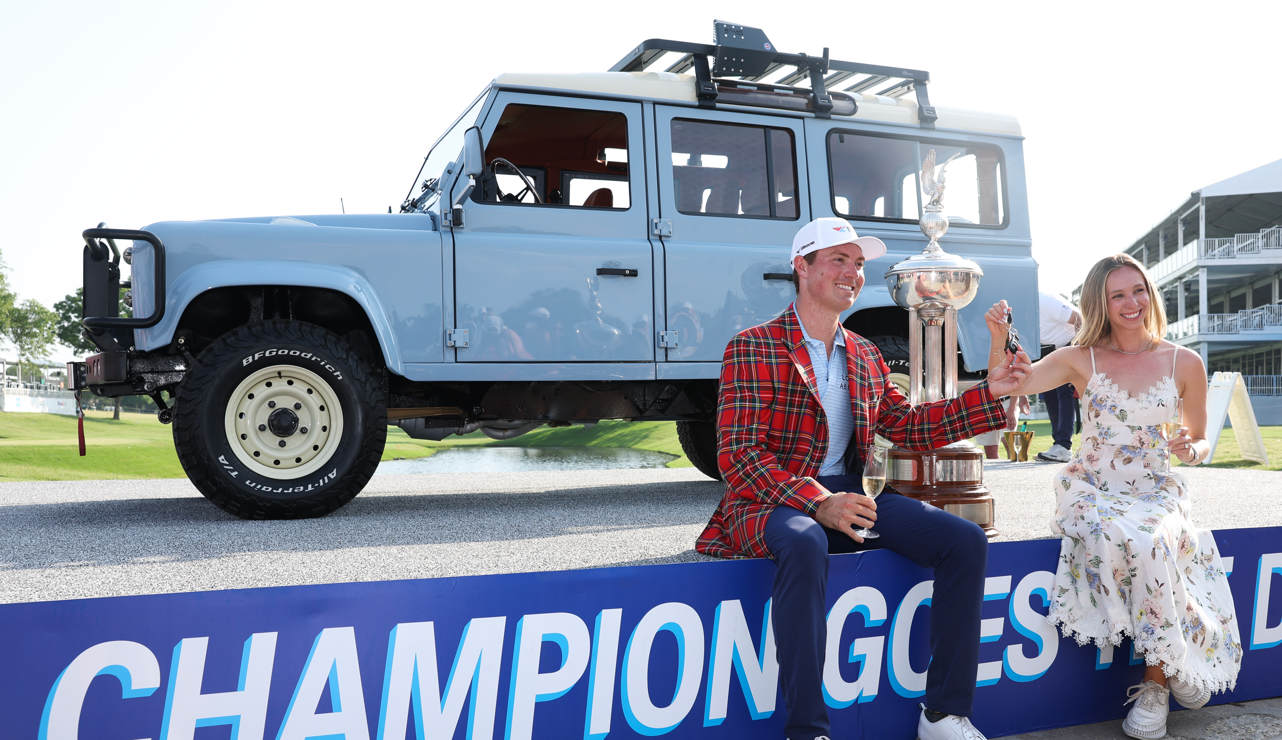 Ben Griffin poses with the Charles Schwab trophy and Land Rover