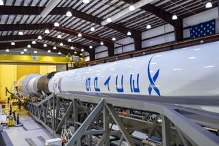 SpaceX will launch 60 Starlink internet satellites into orbit on March 24, 2021 using a veteran Falcon 9 rocket, seen here during preparations for an earlier GPS satellite launch for the U.S. Space Force in June 2020.