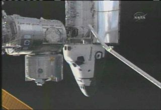 Astronauts Scan Shuttle Heat Shield at Station