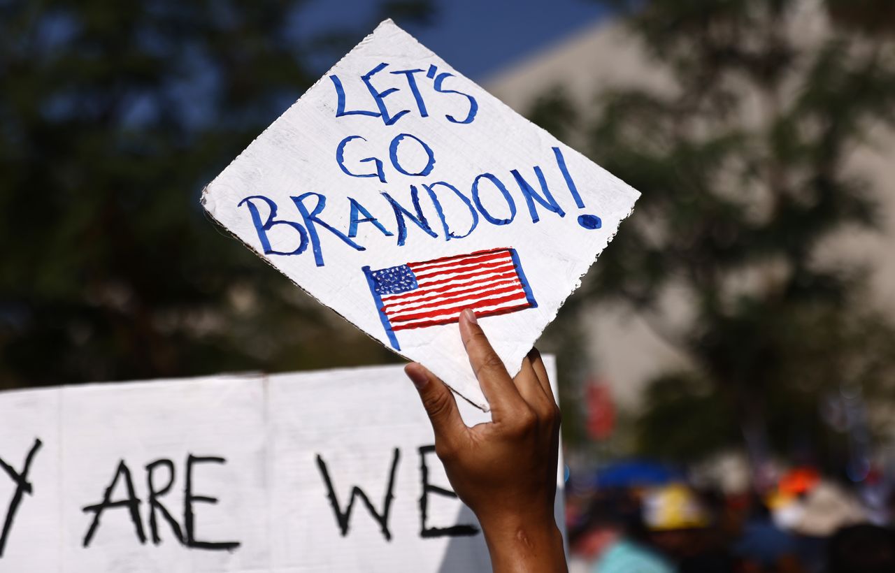 A protestor holds a &amp;#039;Let&amp;#039;s Go Brandon!&amp;#039; sign in Los Angeles