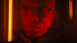 Common looking menacing while bathed in red light in Run All Night.