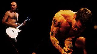Chris Haskett (left, background) and Henry Rollins of Rollins Band perform onstage at the Universal Amphitheater in Universal City, Los Angeles, California on November 24, 1992