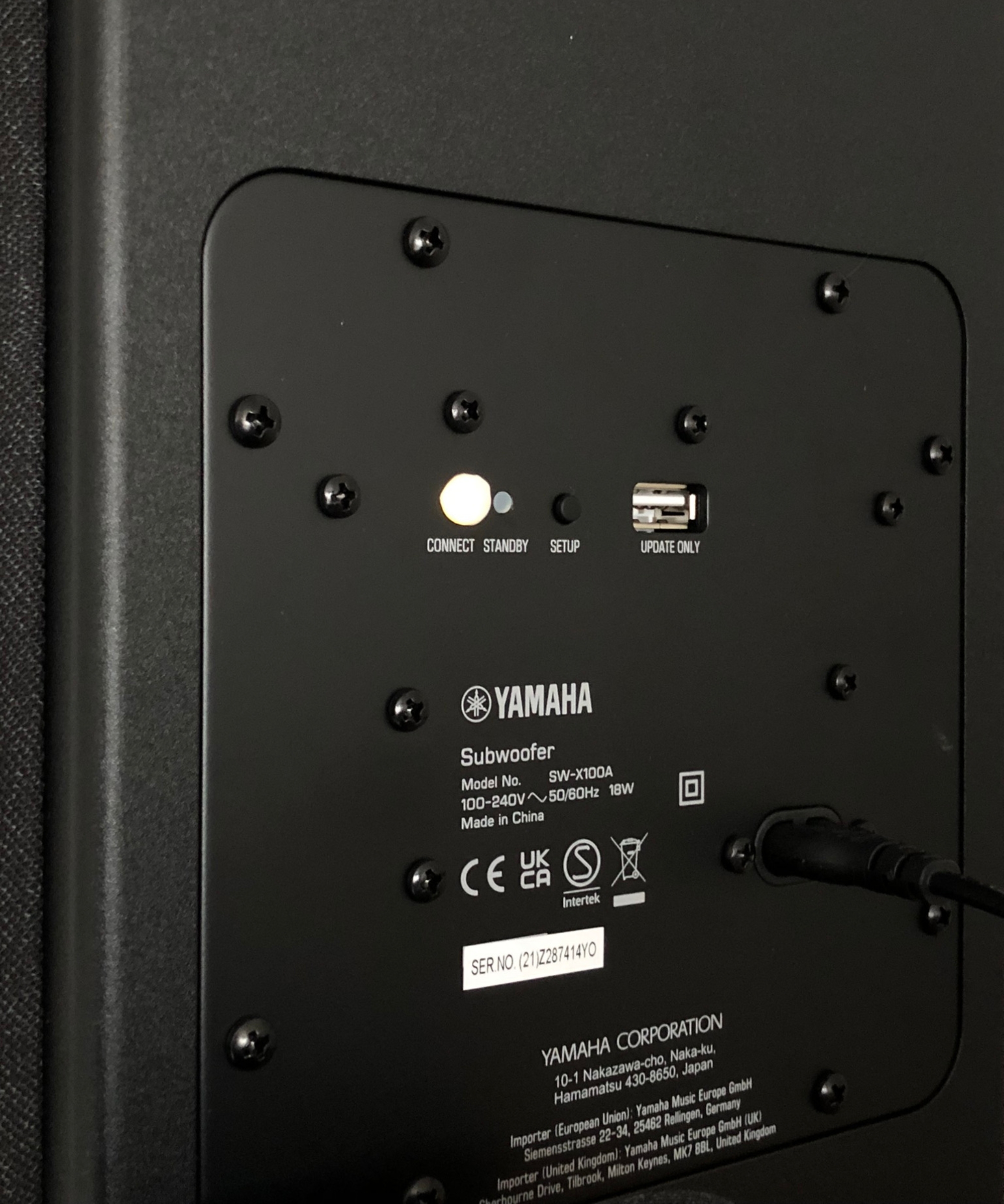Back of the Yamaha True X Bar 50A&#039;s subwoofer with black cable connected.