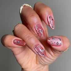 An image of a pink cat eye manicure.