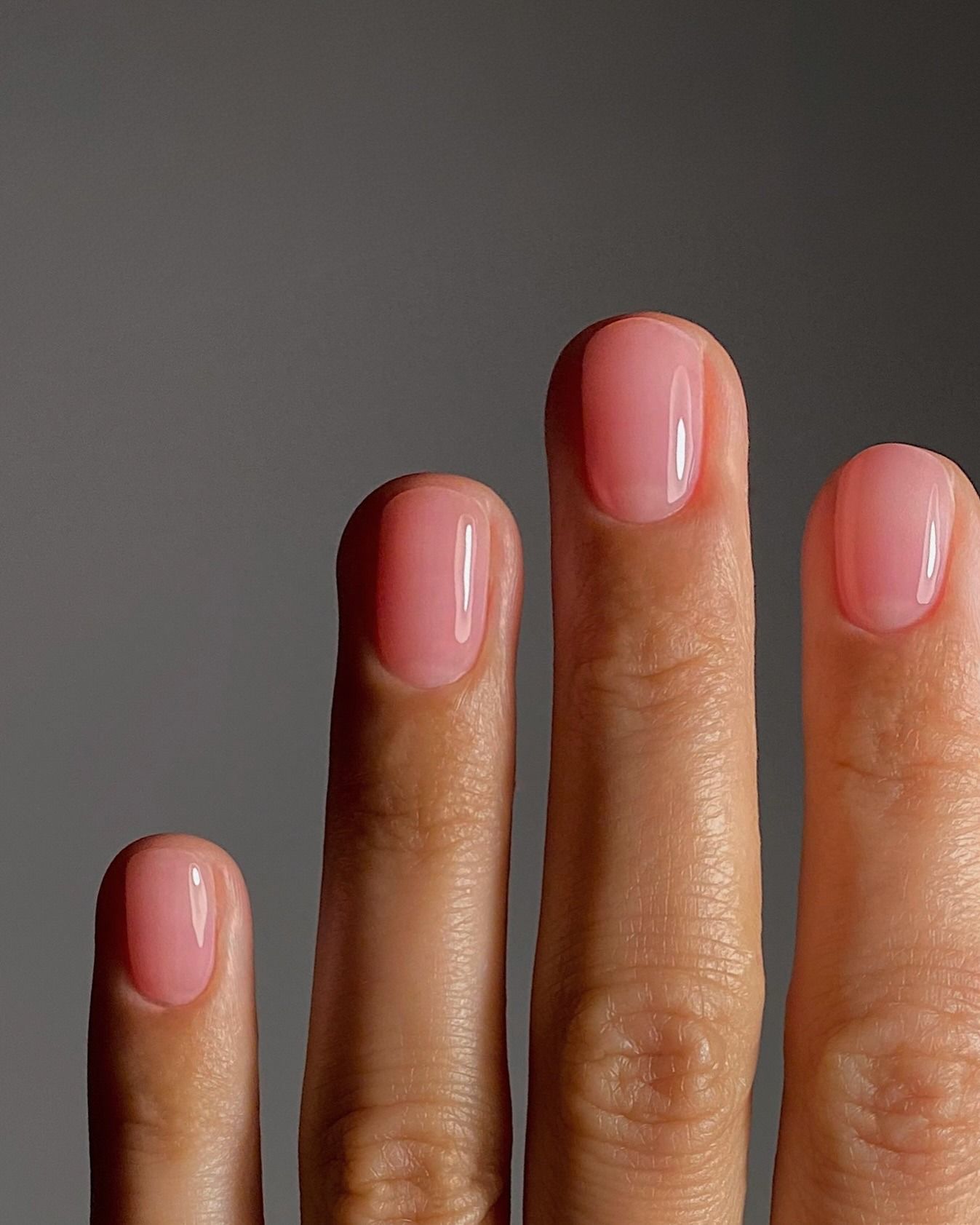 A short sheer bright pink manicure