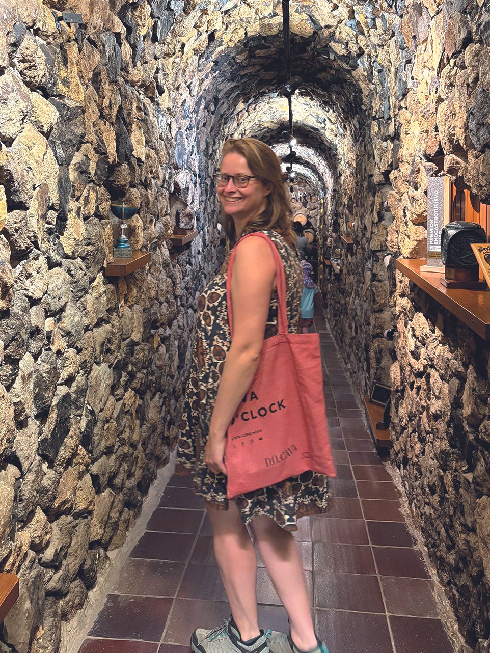 Woman in a wine cellar