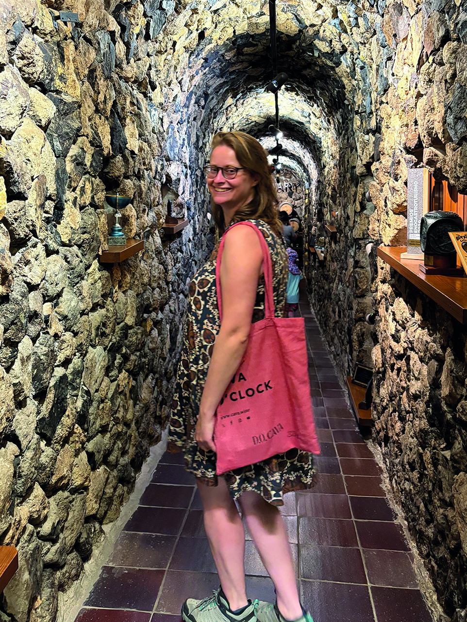 Woman in a wine cellar