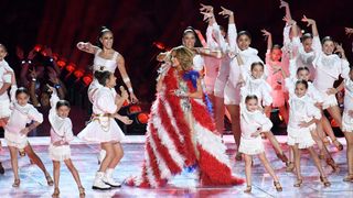 Jennifer Lopez dancing with Puerto Rican flag and children at Super Bowl Halftime Show