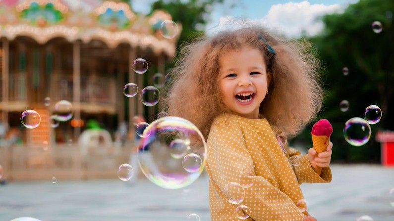 Girl blowing bubbles