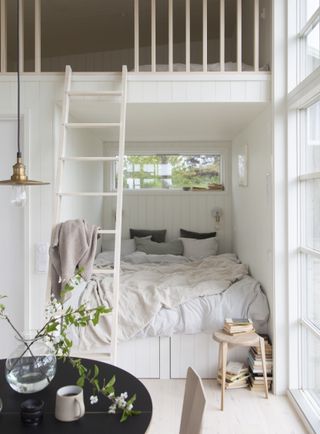 White bedroom with built in bunkbed and under bed storage