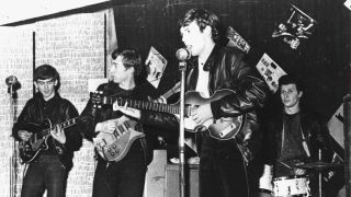 The Beatles perform in a club prior to signing their first recording contract, Liverpool, England, 1962. L-R: George Harrison, John Lennon, Paul McCartney, and original drummer Pete Best.