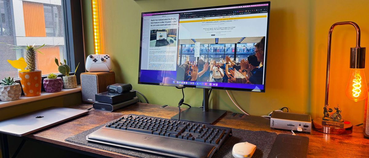 Dough Spectrum Black 27-inch OLED monitor on a desk in a home office.