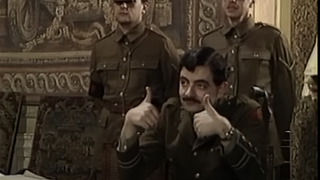 Rowan Atkinson giving the thumbs up to Stephen Fry as they shoot Blackadder Goes Forth