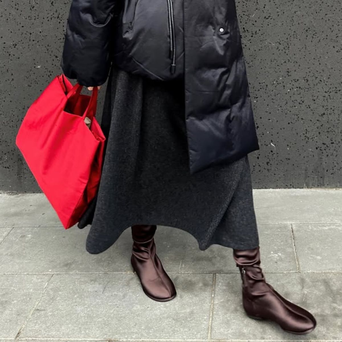 Ksenia Chertovich wearing brown boots