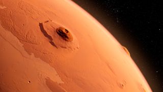 An illustration of Olympus Mons, the largest known volcano in the solar system.