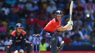 Jos Buttler of England bats watched by Andries Gous during the ICC Men's T20 Cricket World Cup West Indies & USA 2024 Super Eight match between USA and England ahead of the India vs England Semi-Final