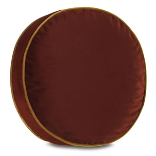 a round brown cushion with a light brown trim