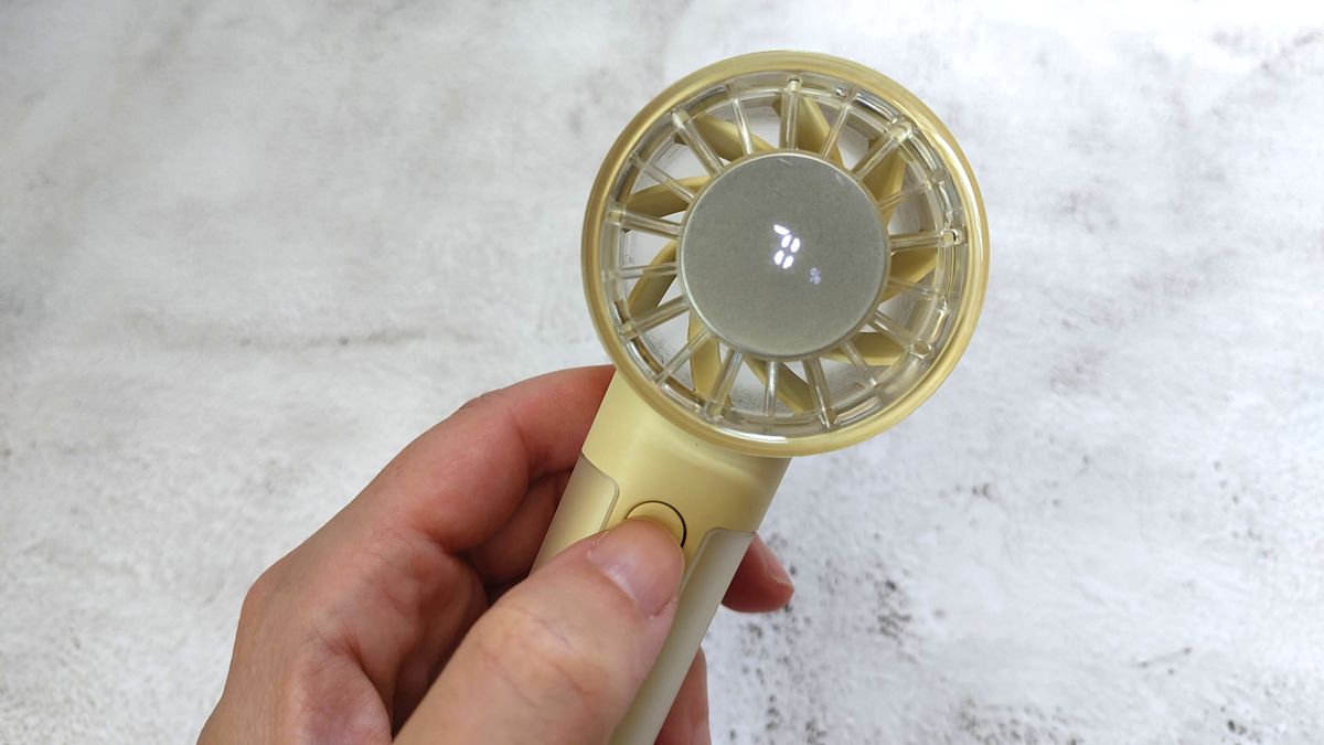 John Lewis fan in reviewer's hand showing hidden display