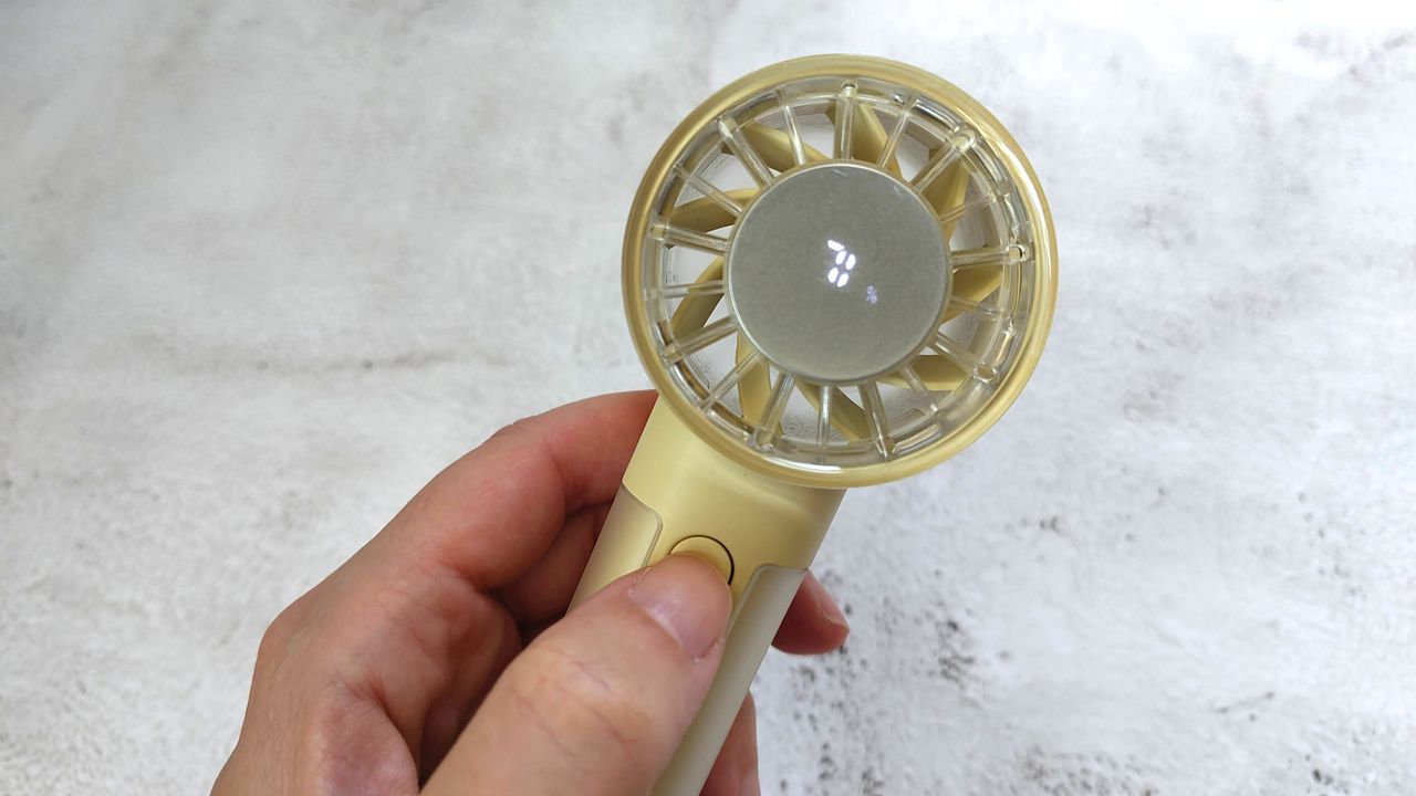 John Lewis fan in reviewer's hand showing hidden display