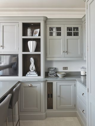 grey kitchen bespoke made with corner wall cabinets and stone floor