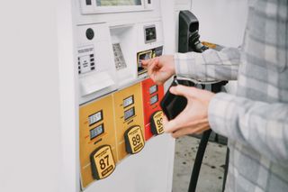 Man purchasing gas at pump