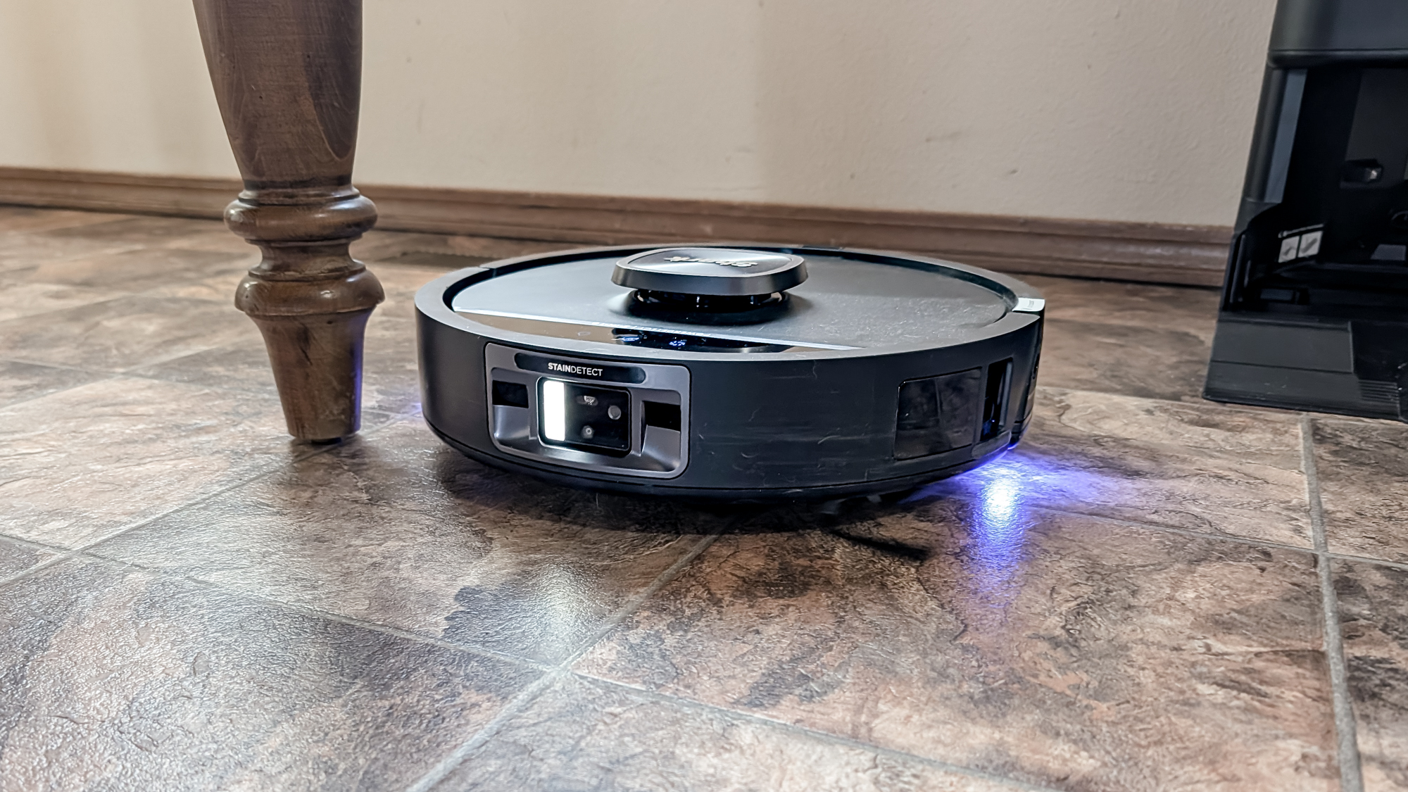 Shark UV Reveal PowerDetect Robot Vacuum on a kitchen floor
