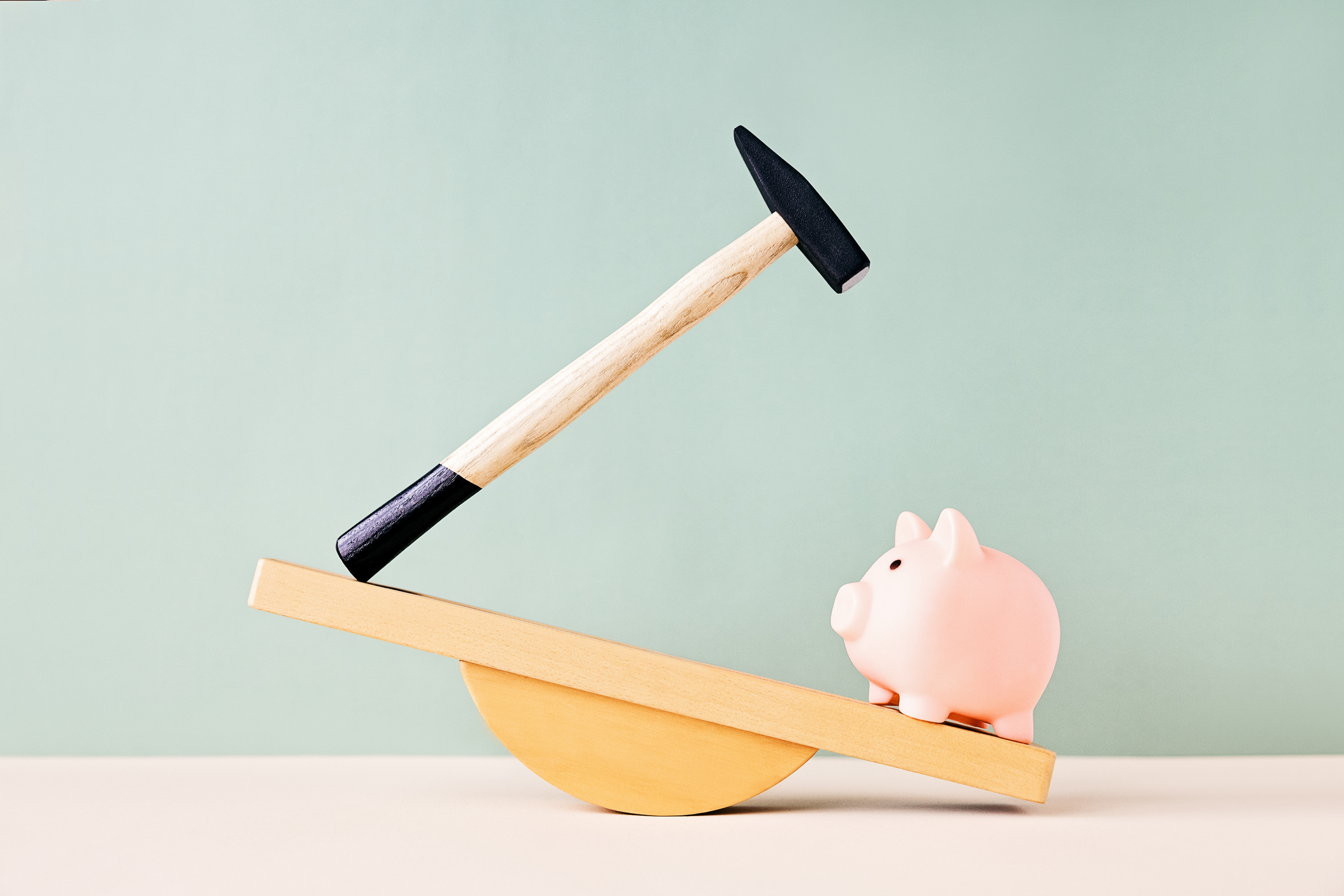 Pink piggy bank and hammer