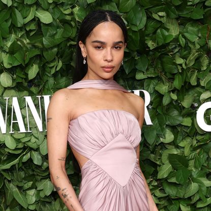 Zoë Kravitz on the Gotham Awards red carpet wearing a strapless ruched dress with a neck tie