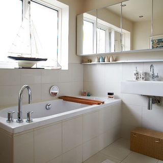 bathroom with white bath and basin