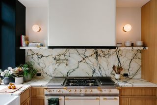 kitchen with marble veining backsplash and wood cabinets