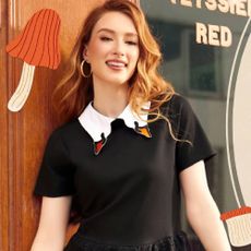 A model wearing a black dress with a white goose collar from ModCloth.