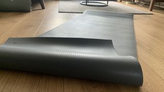 Image of Manduka PROlite yoga mat close up with edge curled over