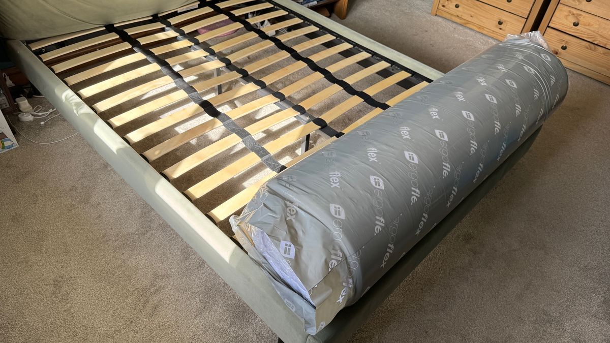 Unpacking the ErgoFlex 5G mattress in our tester's bedroom
