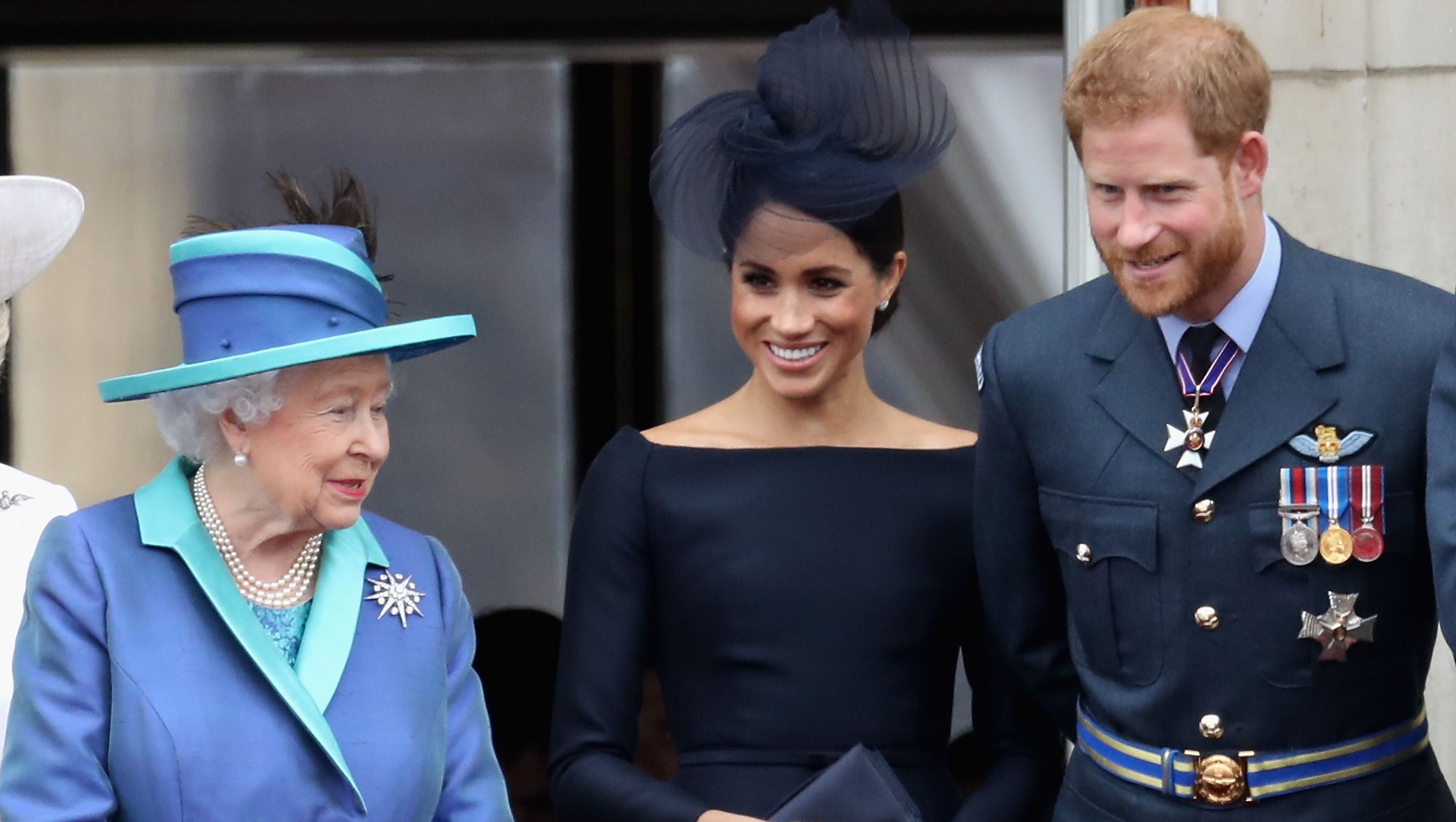 london, england july 10 l r queen elizabeth ii, meghan, duchess of sussex, prince harry, duke of sussex watch the raf flypast on the balcony of buckingham palace, as members of the royal family attend events to mark the centenary of the raf on july 10, 2018 in london, england photo by chris jacksongetty images