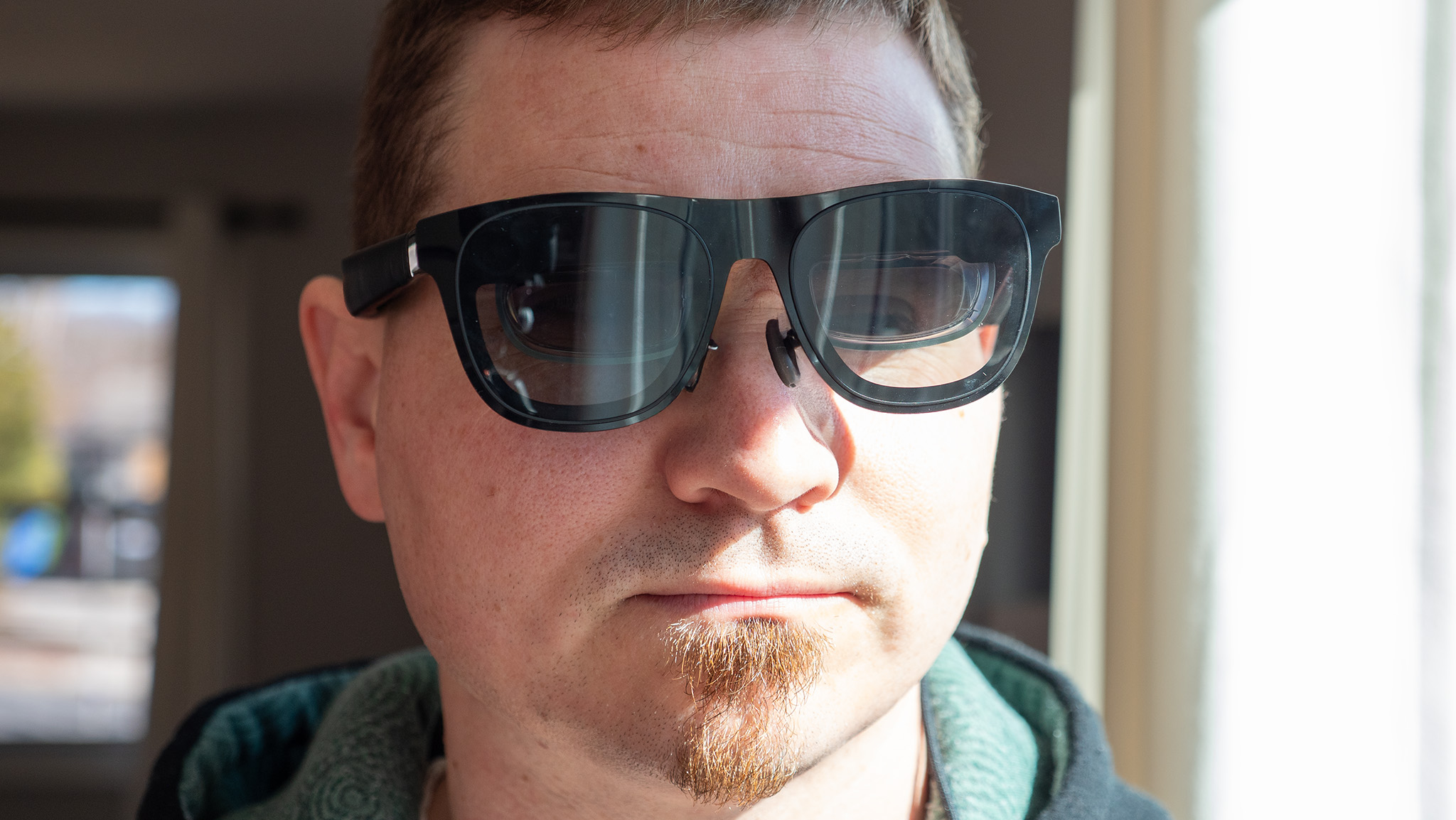 Wearing a pair of Xreal One smart glasses to show off the fit and size