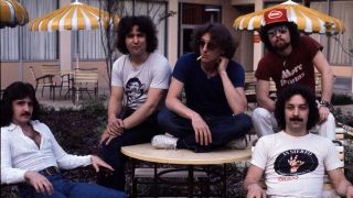 Blue Osyter Cult posing outside a hotel