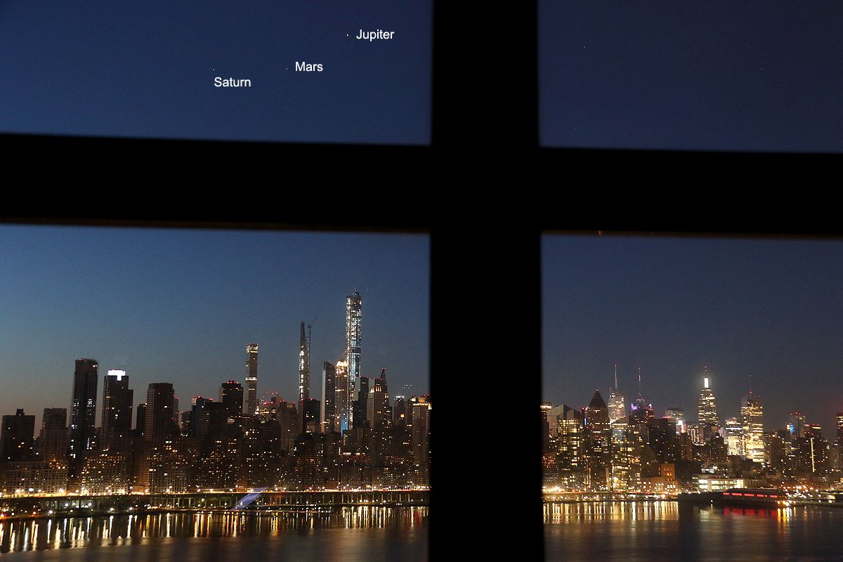 Saturn, Mars and Jupiter align over the New York City skyline on March 26, 2020.
