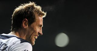 Tottenham Hotspur's Peter Crouch celebrates scoring the third goal against Werder Bremen during the UEFA Champions League group A football match at White Hart Lane in London on November 24, 2010. Tottenham won the game 3-0 and qualify for the knockout phase of the competition.