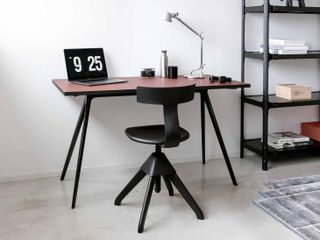 writing desk with black legs and dark red top