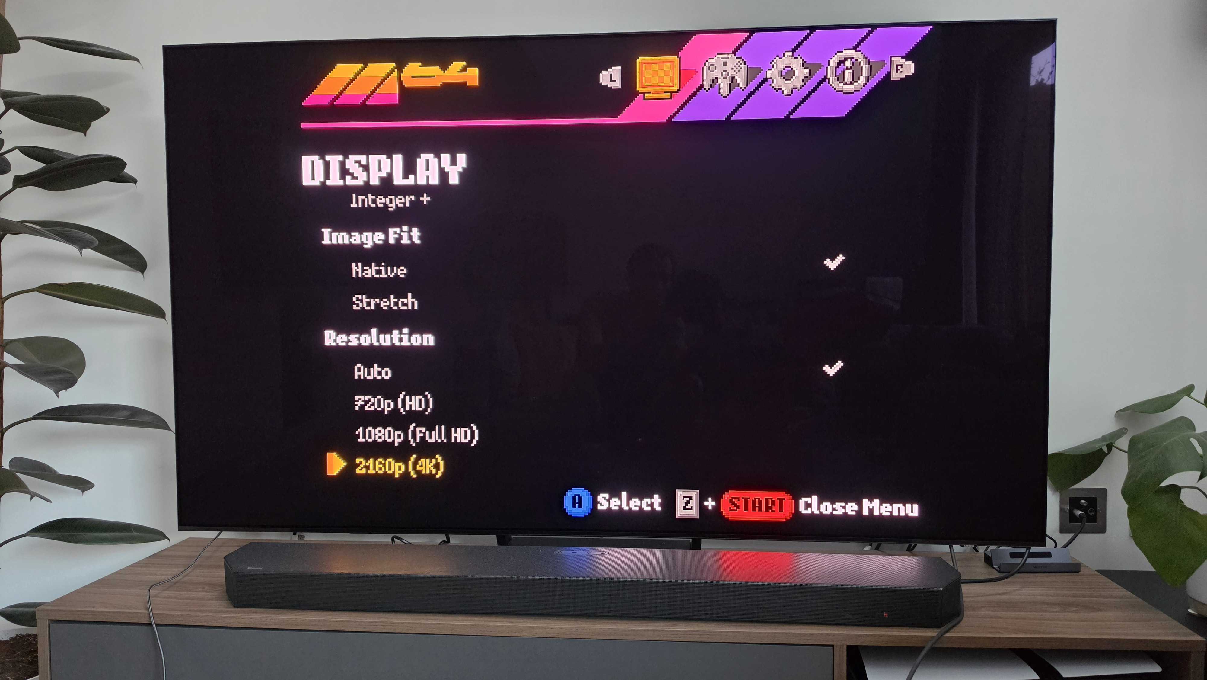 A TV showing the settings options on the ModRetro M64