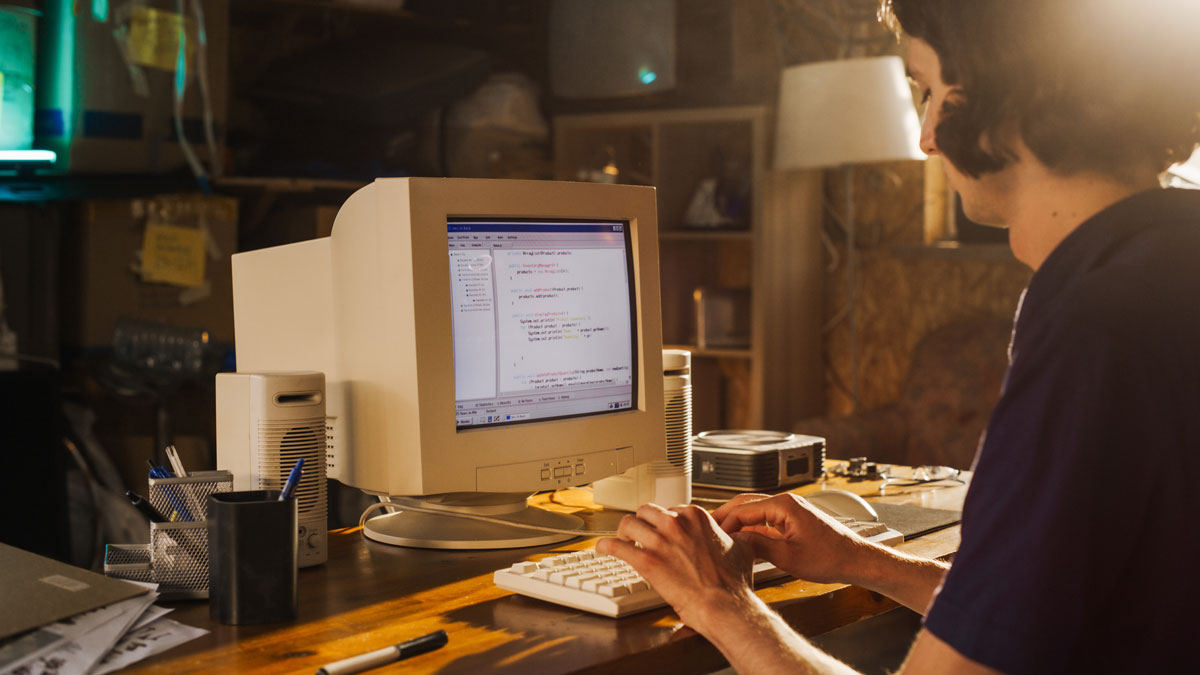 Woman sitting at the retro screen