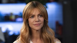 Morgan smiling inside police precinct in High Potential Season 2