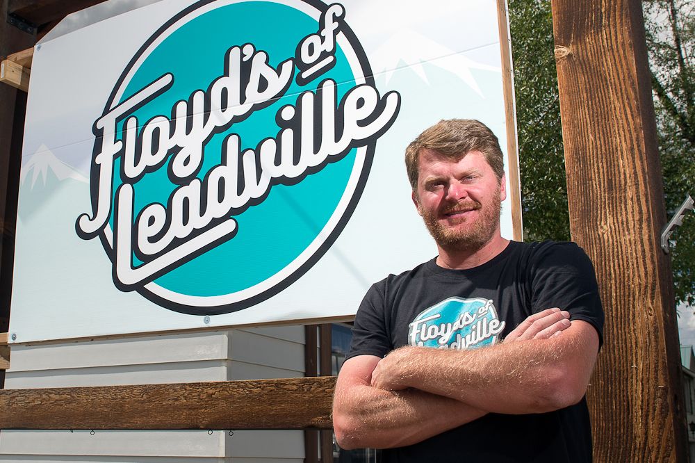 Floyd poses with his Floyd's of Leadville logo during the grand opening