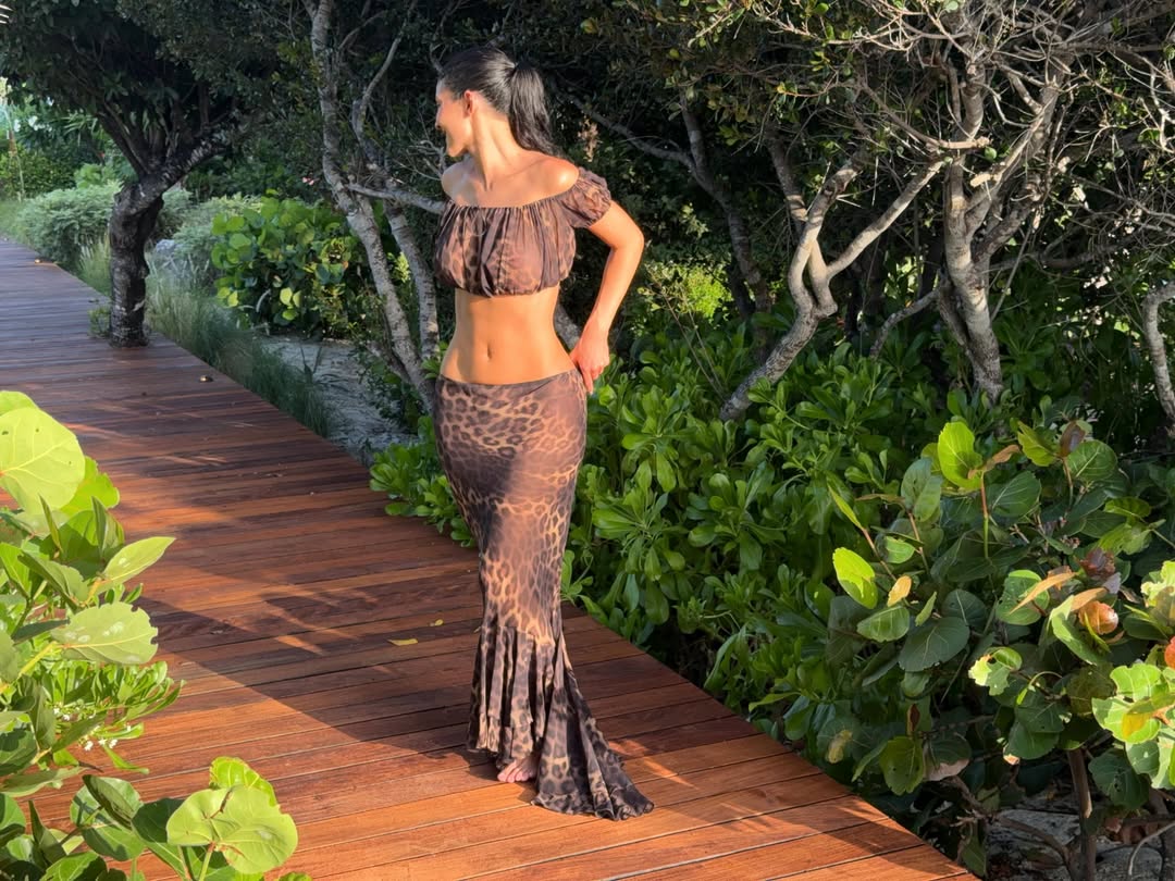 Kylie Jenner styled a matching skirt set in the leopard-print trend on her Kylie Cosmetics trip