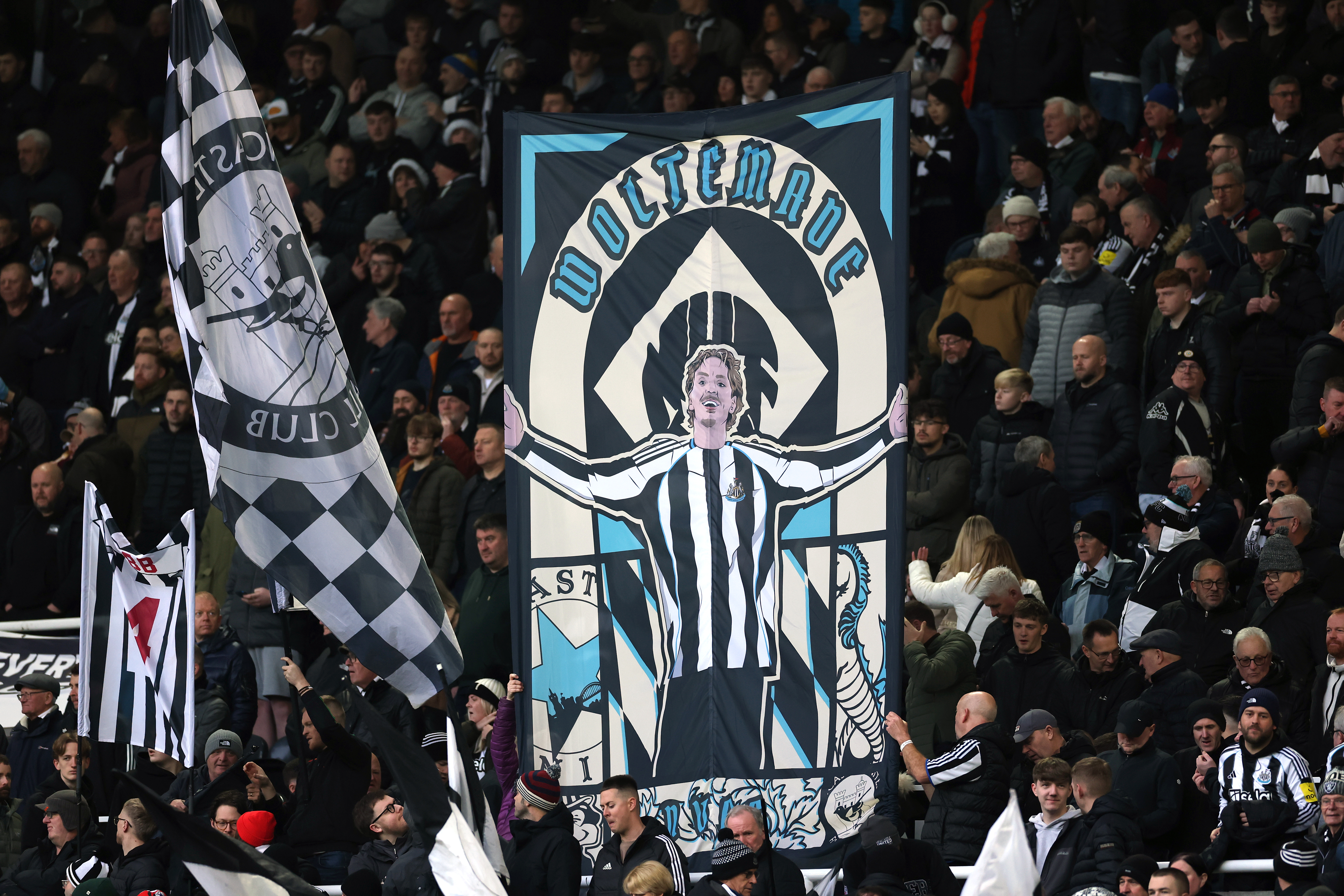 NEWCASTLE UPON TYNE, ENGLAND - DECEMBER 20: A flag featuring Nick Woltemade of Newcastle United pictured in the Gallowgate End during the Premier League match between Newcastle United and Chelsea at St James&amp;apos; Park on December 20, 2025 in Newcastle upon Tyne, England. (Photo by Stu Forster/Getty Images)