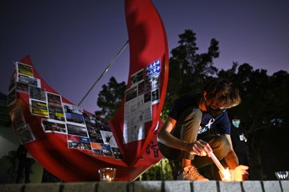 Hong Kong protester commemorates fellow protester who died in demonstration.