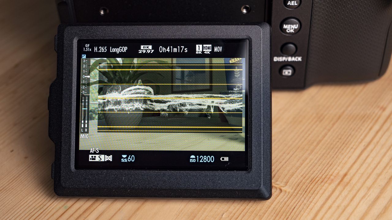 Close up of the Fujifilm GFX100 II 's rear LCD displaying video waveform and vector info