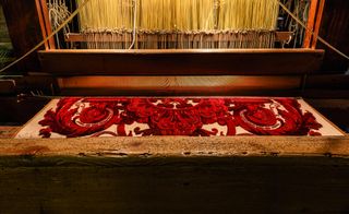 An antique weaving loom at antique Venetian weaving workshop Tessitura Bevilaqua